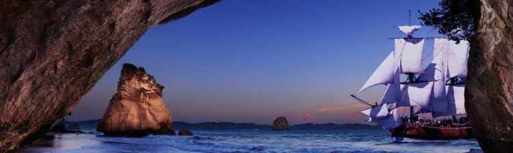Cooks Journey to Mercury Bay Replica of the Endeavour at Cathedral Cove
